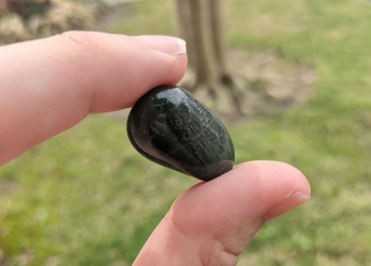 Dark green aventurine crystal with mica inclusions