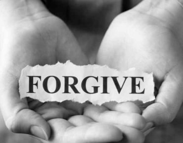 Open hands with forgive sign
