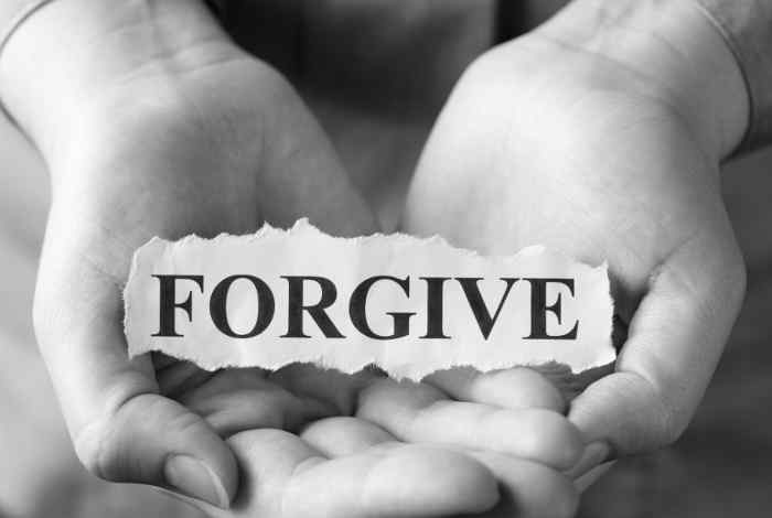 Open hands with forgive sign