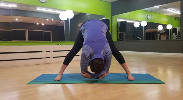 Wide-legged forward bend yoga pose - Prasarita Padottanasana